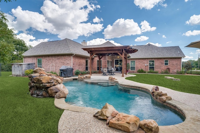 outdoor pool featuring a patio area, a lawn, a pergola, and area for grilling