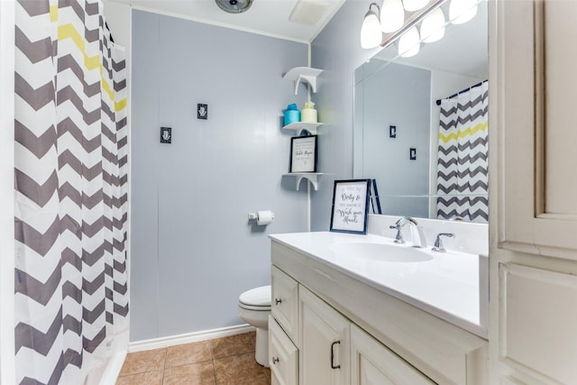 bathroom featuring toilet, vanity, a shower with shower curtain, and tile patterned floors