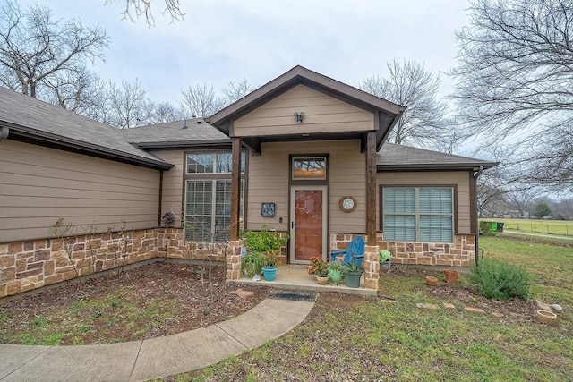 view of front of home featuring stone siding