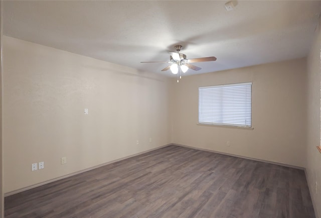 unfurnished room with ceiling fan and wood finished floors