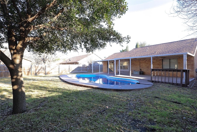 view of yard with a patio, a fenced backyard, and a fenced in pool