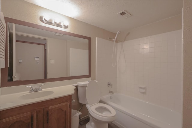 full bathroom with visible vents, a textured wall, washtub / shower combination, a textured ceiling, and vanity