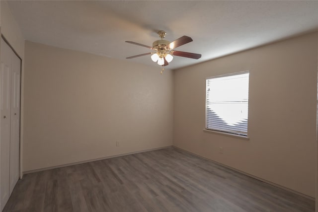 unfurnished room with ceiling fan and wood finished floors