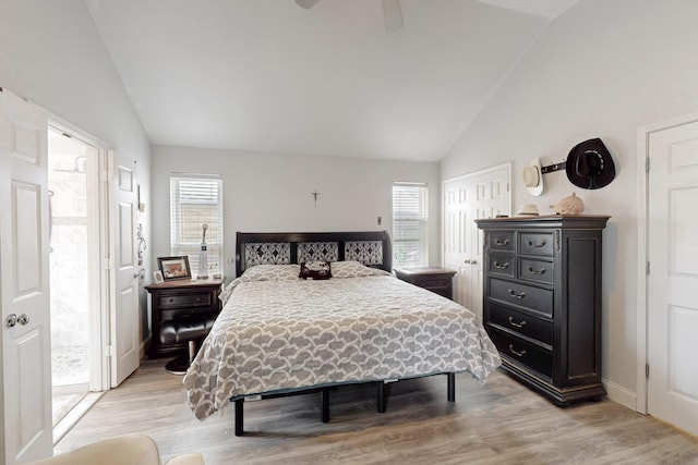211 Ember Glen Dr, Arlington, TX 76018 - bedroom featuring vaulted ceiling, multiple windows, light wood-style floors, ceiling fan, and baseboards
