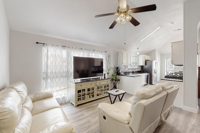 211 Ember Glen Dr, Arlington, TX 76018 - living area with a ceiling fan, light wood finished floors, and vaulted ceiling