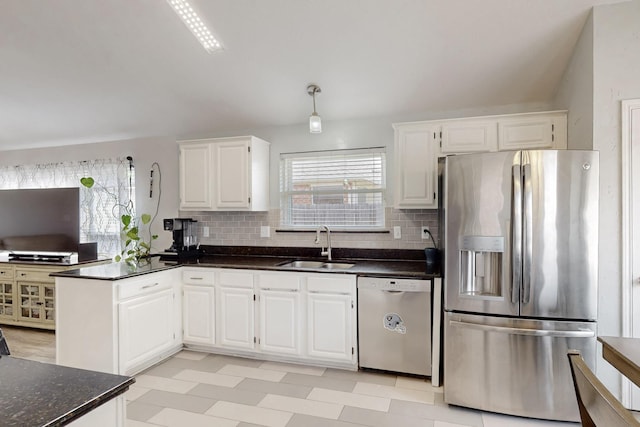 211 Ember Glen Dr, Arlington, TX 76018 - kitchen featuring appliances with stainless steel finishes, a sink, white cabinetry, and light flooring