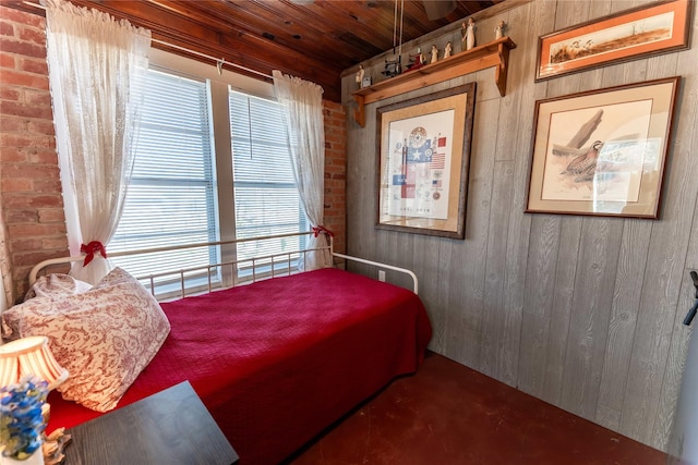 bedroom with wooden ceiling and wooden walls