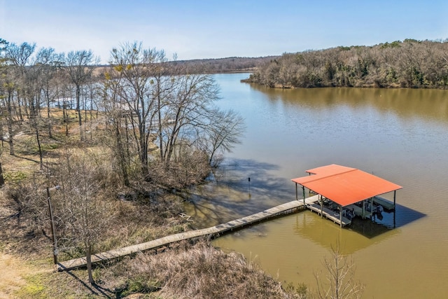 view of dock with boat lift and a water view