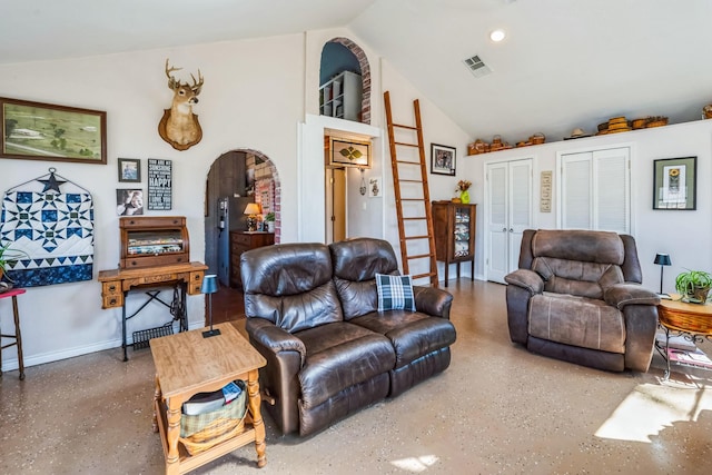 living area featuring speckled floor, visible vents, high vaulted ceiling, baseboards, and arched walkways