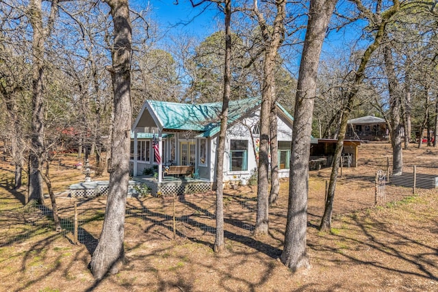 view of yard featuring a wooden deck and fence