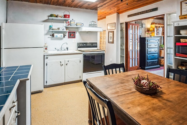 kitchen featuring open shelves, a sink, white cabinets, under cabinet range hood, and white appliances