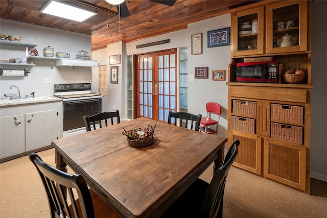 dining space featuring french doors, wood ceiling, and ceiling fan