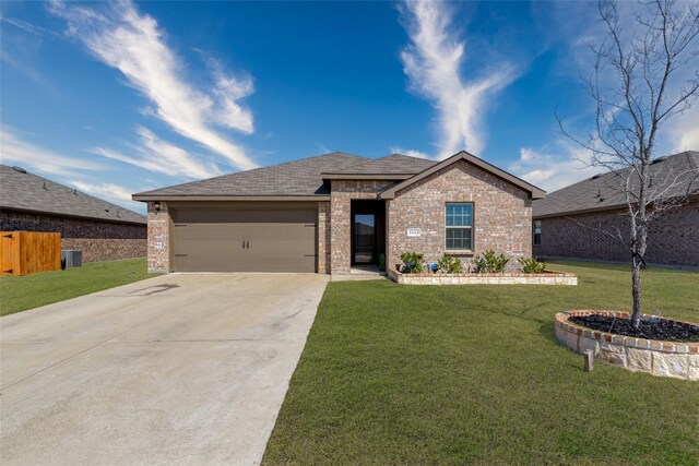 ranch-style house featuring an attached garage, a front lawn, concrete driveway, and brick siding