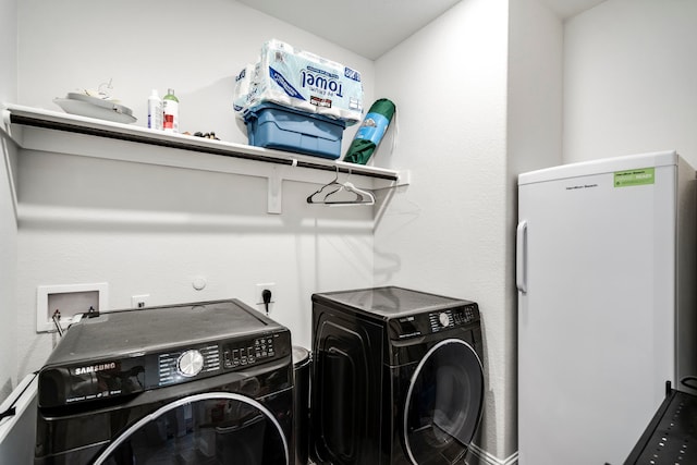 laundry room featuring laundry area and washing machine and dryer