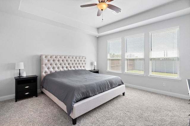 bedroom featuring visible vents, baseboards, and light colored carpet