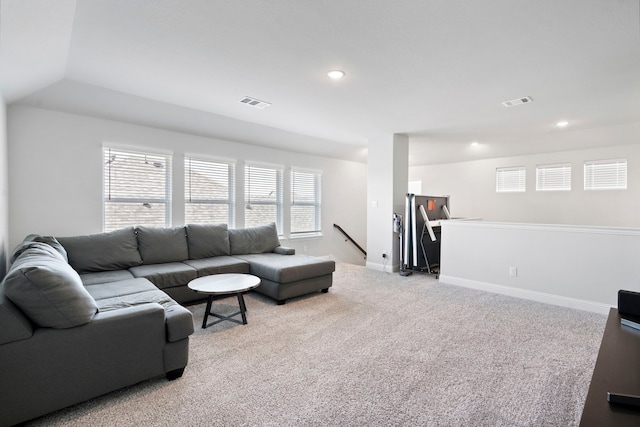 living area with light colored carpet, visible vents, baseboards, and recessed lighting