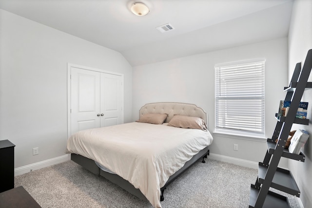 bedroom with carpet, visible vents, and baseboards