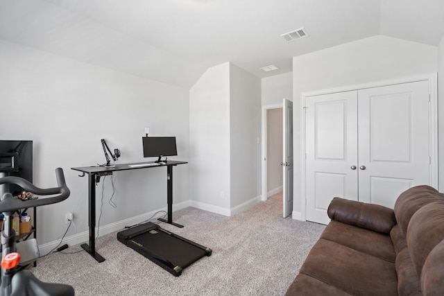 workout area featuring lofted ceiling, baseboards, visible vents, and carpet flooring