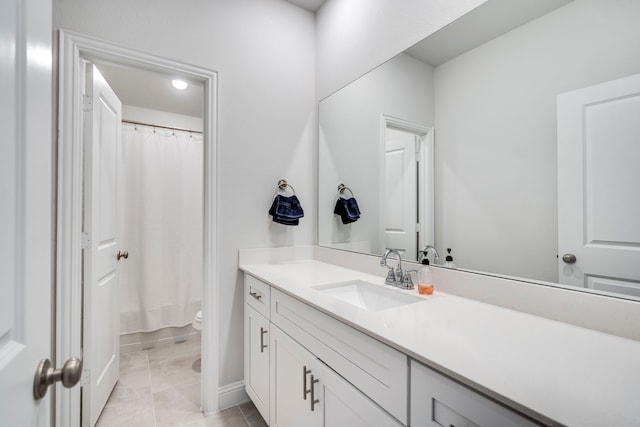 full bath featuring toilet, tile patterned flooring, vanity, and a shower with curtain