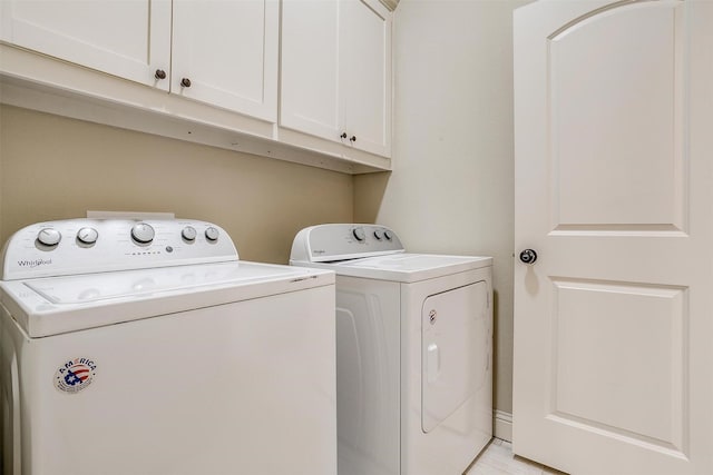 laundry area featuring cabinet space and washer and clothes dryer