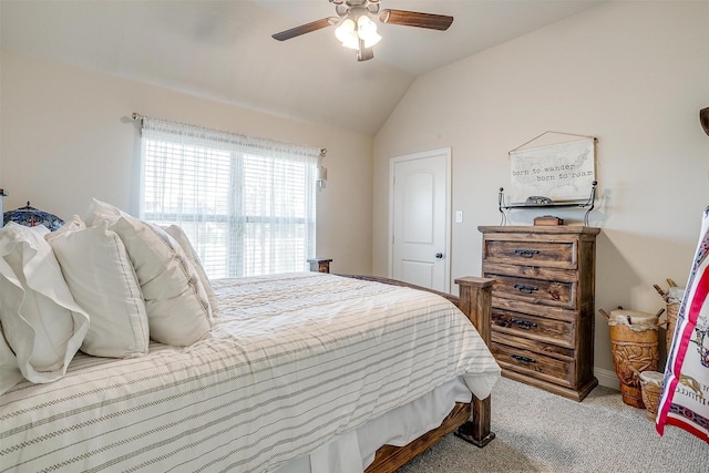 bedroom featuring lofted ceiling, carpet, and a ceiling fan