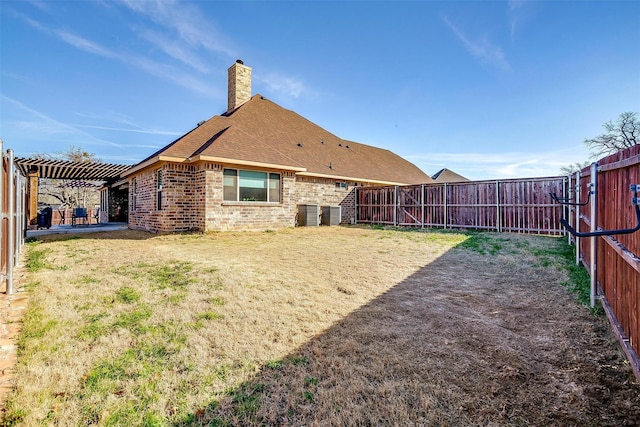 view of yard featuring a patio area, a fenced backyard, and a pergola