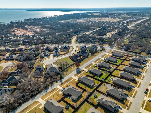 birds eye view of property featuring a water view and a residential view