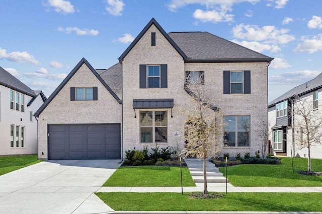 view of front of house featuring a front yard, brick siding, driveway, and roof with shingles