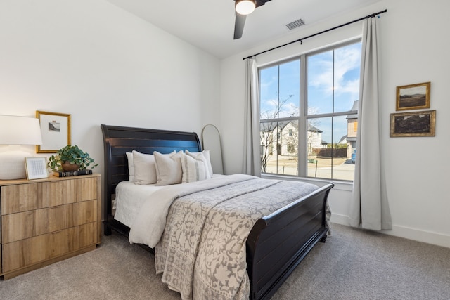 bedroom with ceiling fan, lofted ceiling, light carpet, visible vents, and baseboards