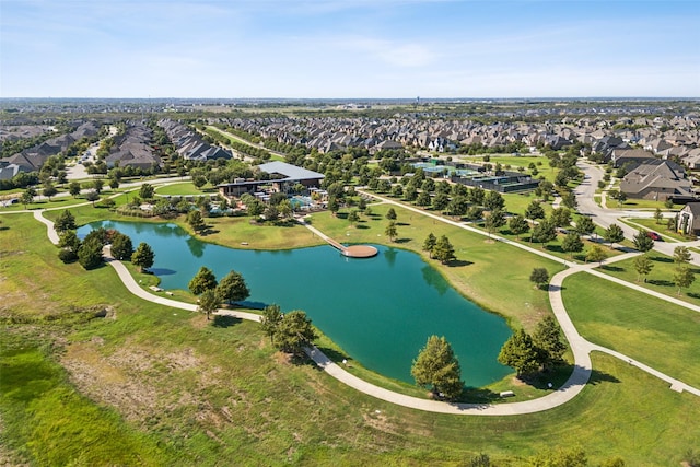 birds eye view of property with a water view and a residential view