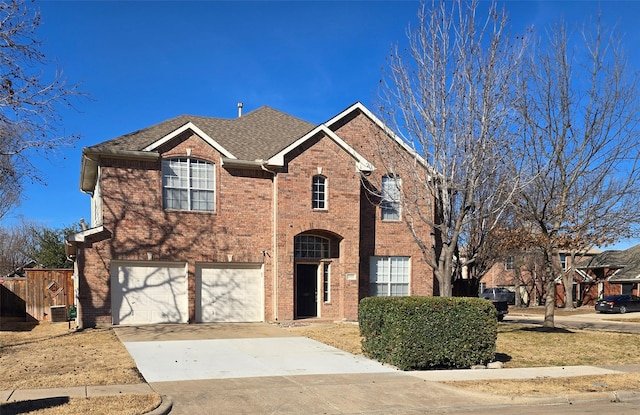 view of front of property featuring central AC unit, a garage, brick siding, driveway, and roof with shingles