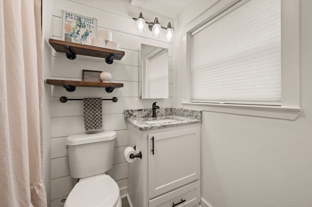 full bathroom featuring vanity and toilet