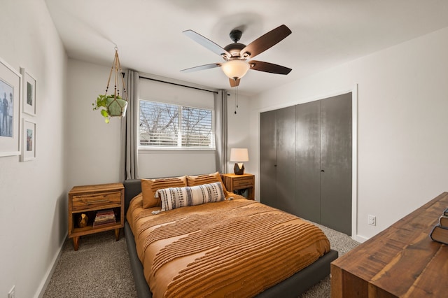 carpeted bedroom with a closet, a ceiling fan, and baseboards