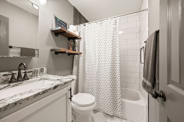 full bathroom featuring tile patterned flooring, vanity, toilet, and shower / tub combo with curtain