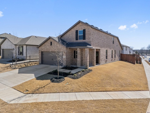 traditional-style home with driveway, fence, and brick siding