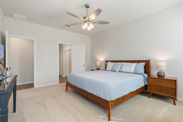 bedroom featuring a ceiling fan, visible vents, baseboards, and carpet flooring