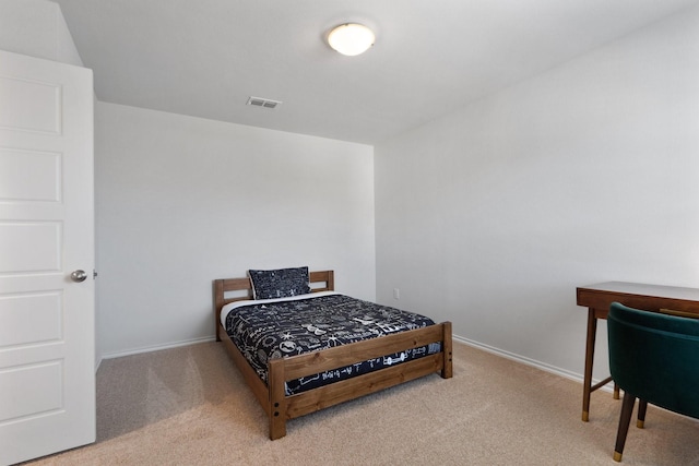 bedroom featuring carpet floors, visible vents, and baseboards