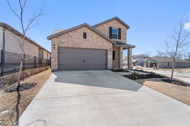 view of front of property with a garage, brick siding, fence, and driveway