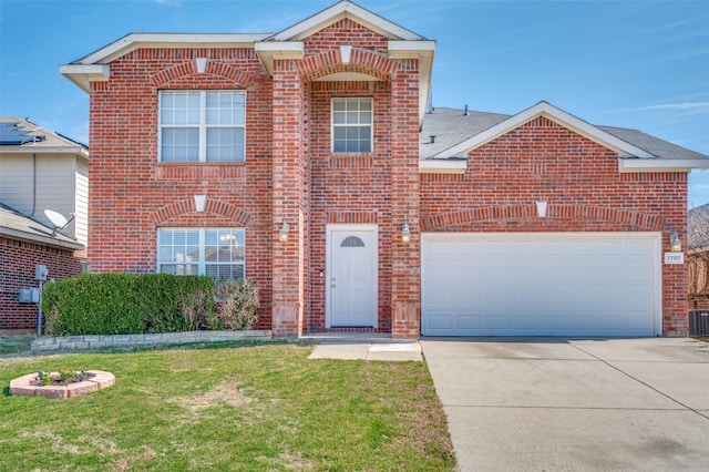 traditional-style home featuring a front yard, brick siding, driveway, and an attached garage