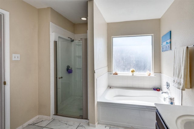 full bath with marble finish floor, a stall shower, a garden tub, and vanity