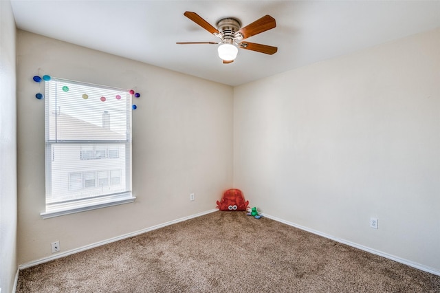 playroom featuring carpet flooring, a ceiling fan, and baseboards