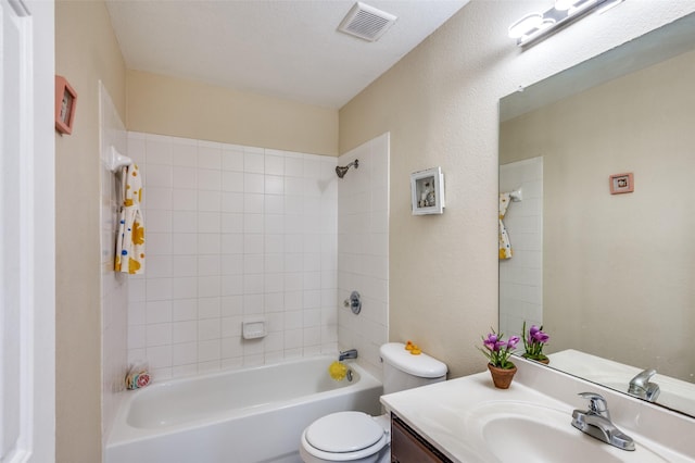 bathroom with toilet, bathtub / shower combination, visible vents, and vanity