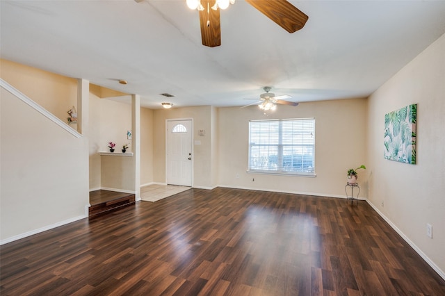 unfurnished living room with ceiling fan, visible vents, baseboards, and wood finished floors