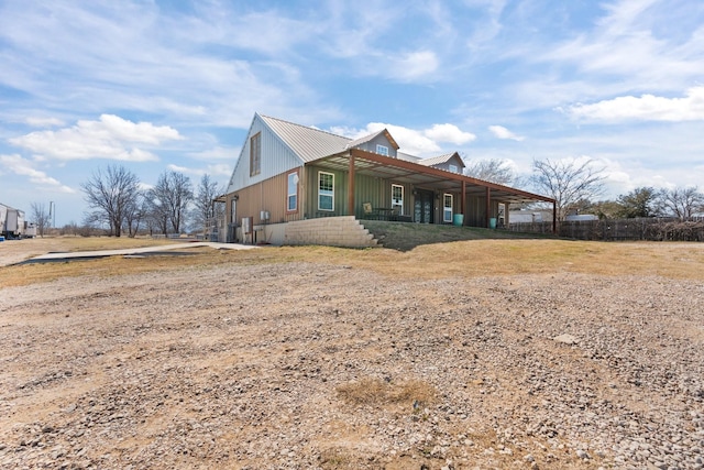 view of property exterior with metal roof