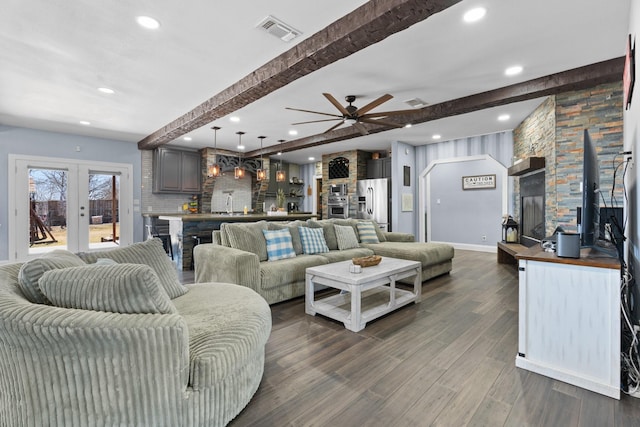 living area featuring baseboards, visible vents, dark wood-style floors, french doors, and beam ceiling