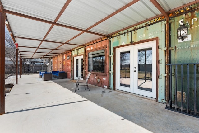 view of patio / terrace with an outdoor hangout area, french doors, and fence