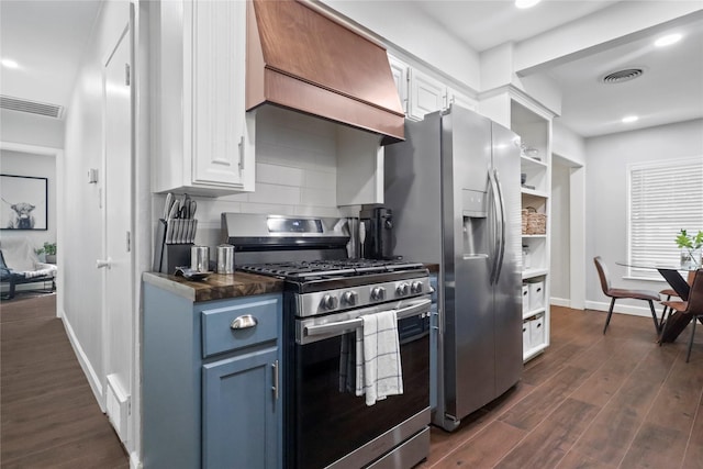 kitchen with stainless steel appliances, dark wood-style flooring, visible vents, backsplash, and custom range hood