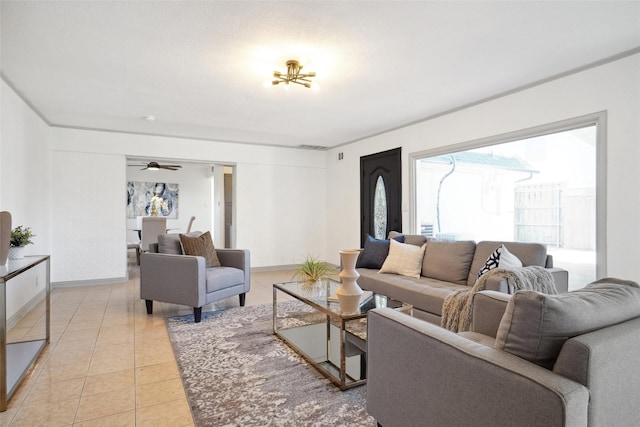 living room featuring light tile patterned floors and baseboards