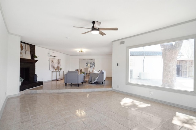 unfurnished living room featuring visible vents, a wall mounted AC, a brick fireplace, ceiling fan, and baseboards