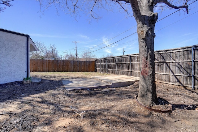 view of yard featuring a patio and a fenced backyard